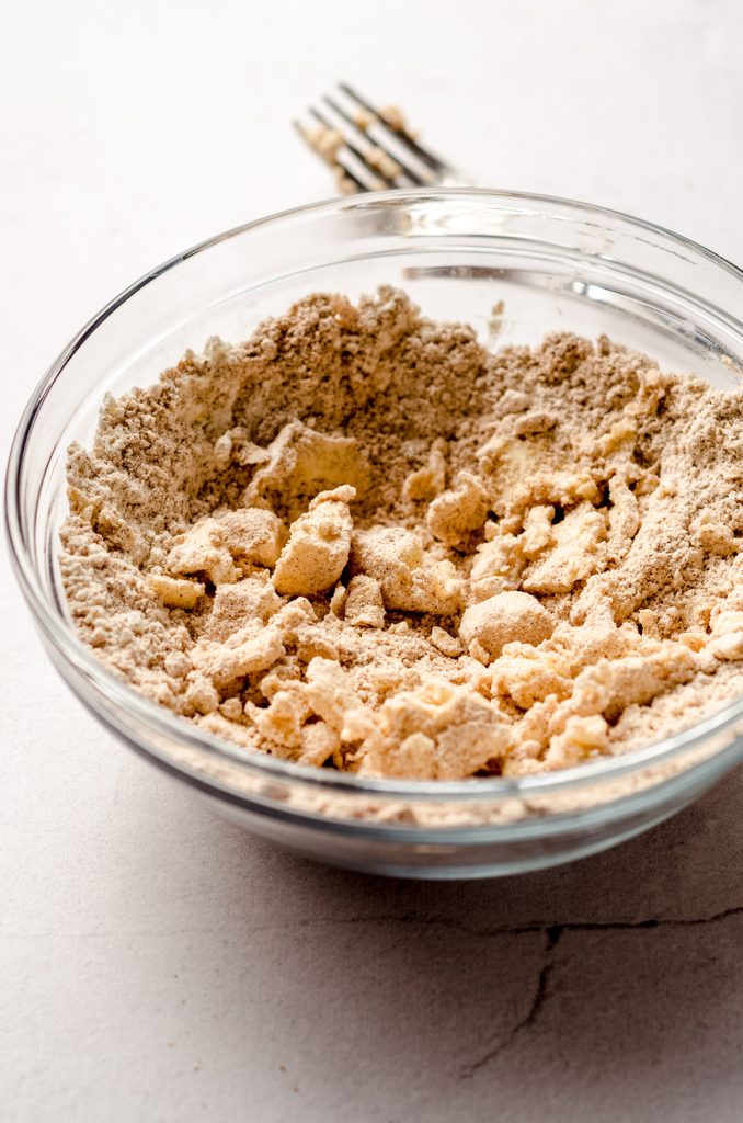 chunks of butter in streusel topping in a bowl