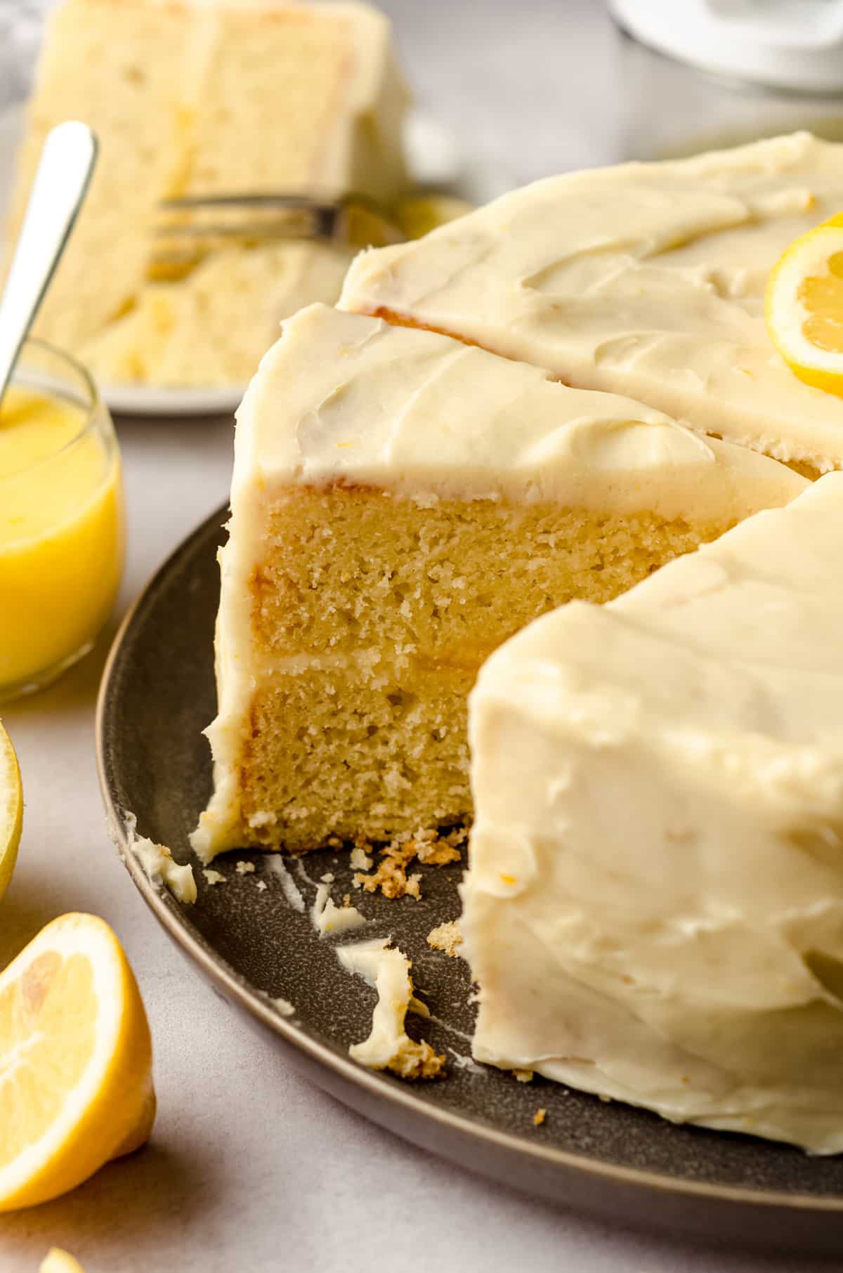 A lemon layer cake, sliced so you can see the lemon curd filling.