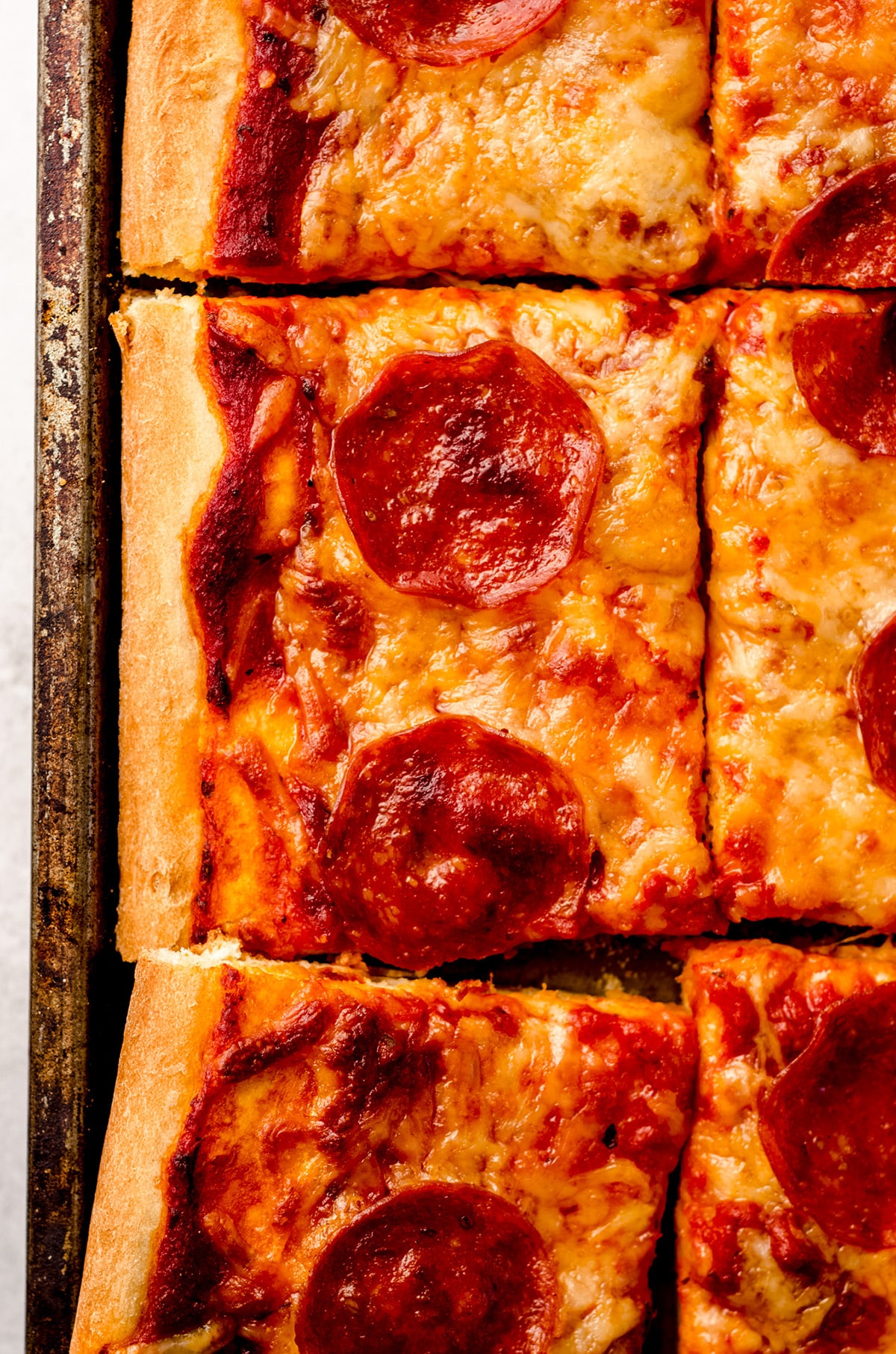 An overhead shot of homemade pizza topped with pepperoni.