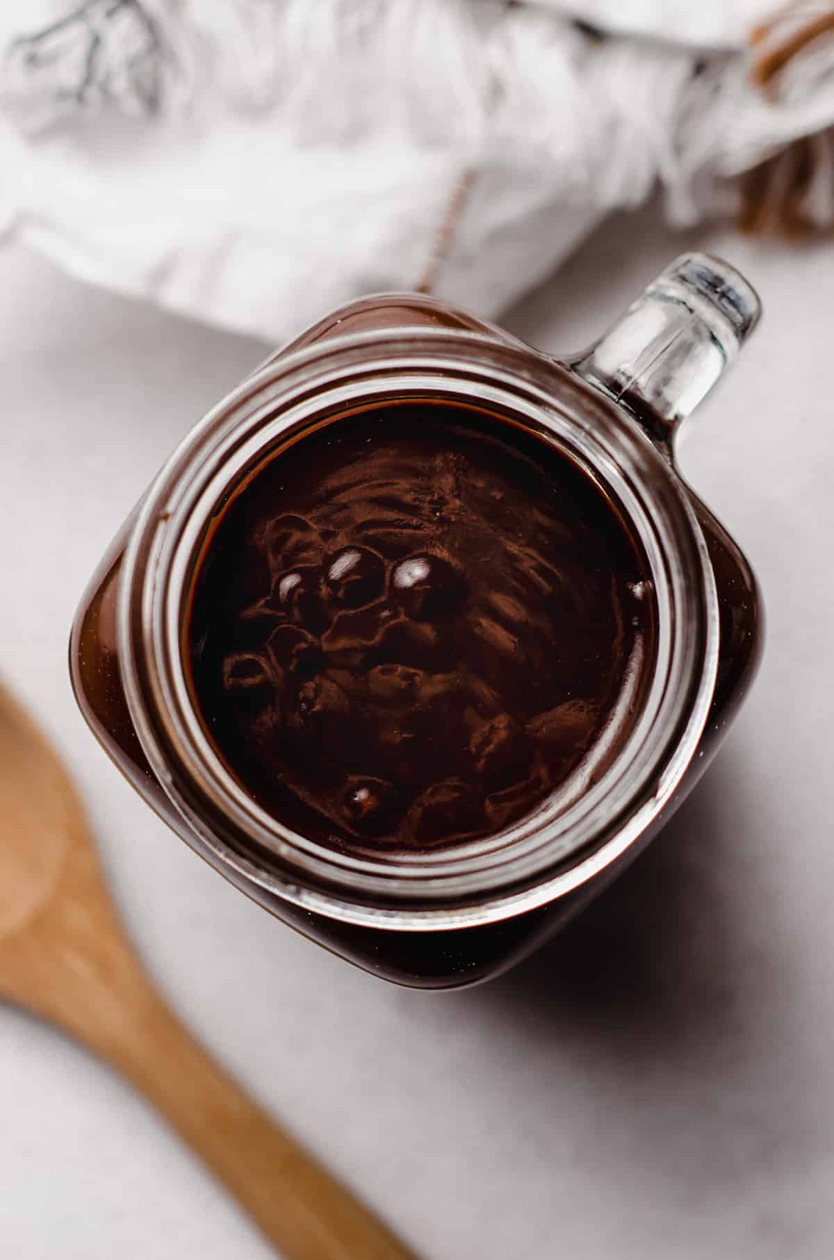 aerial photo of a jar of hot fudge