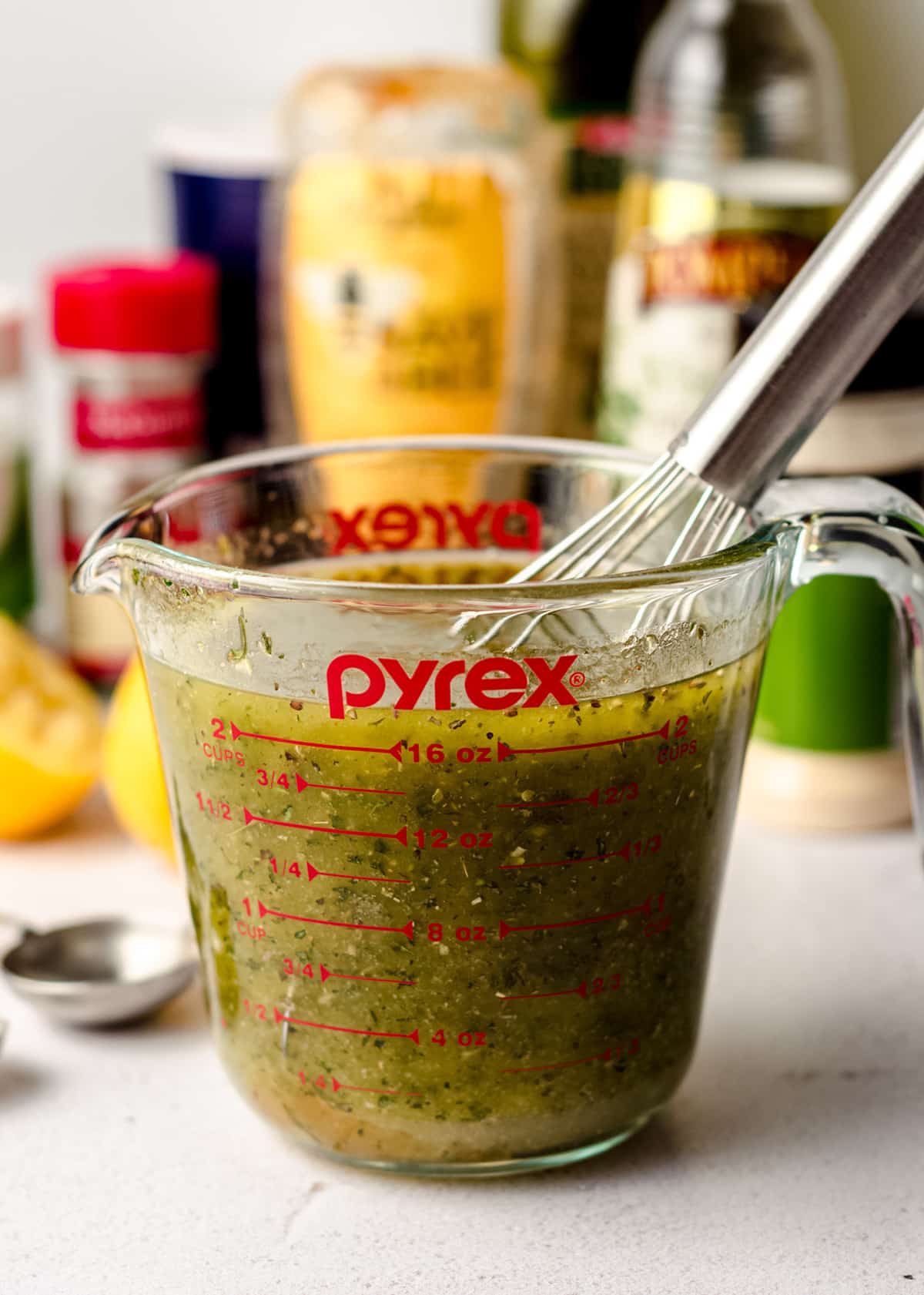 homemade italian dressing in a measuring cup