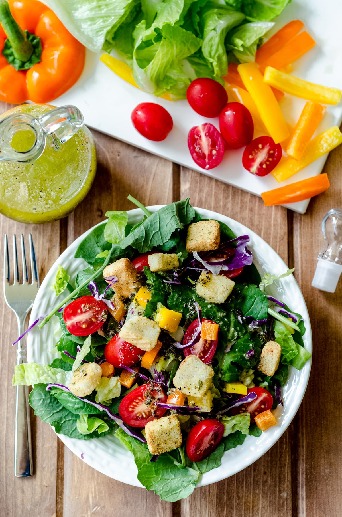 aerial photo of salad on a plate with lots of fresh veggies