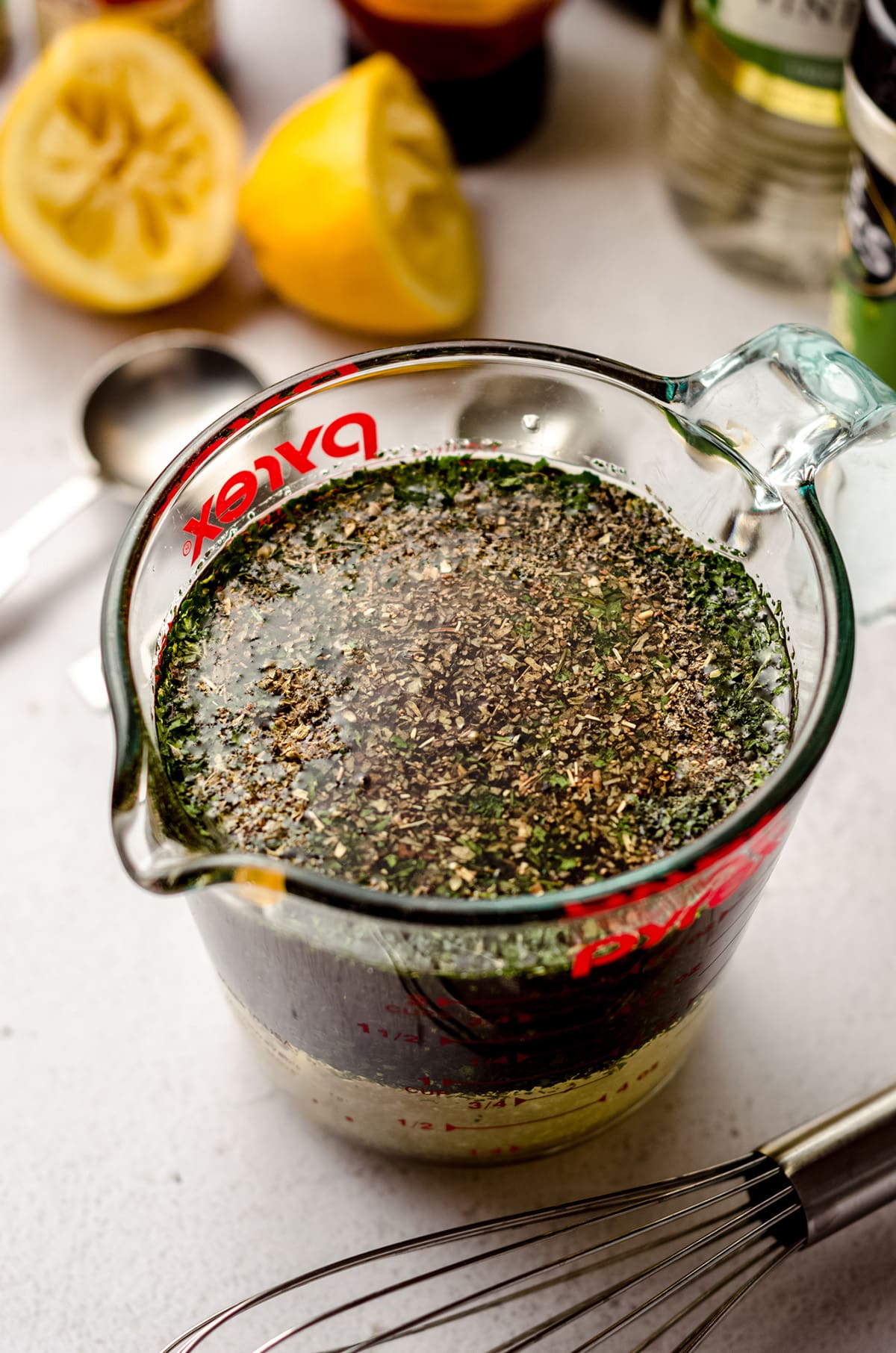 italian salad dressing in a measuring cup before being whisked together