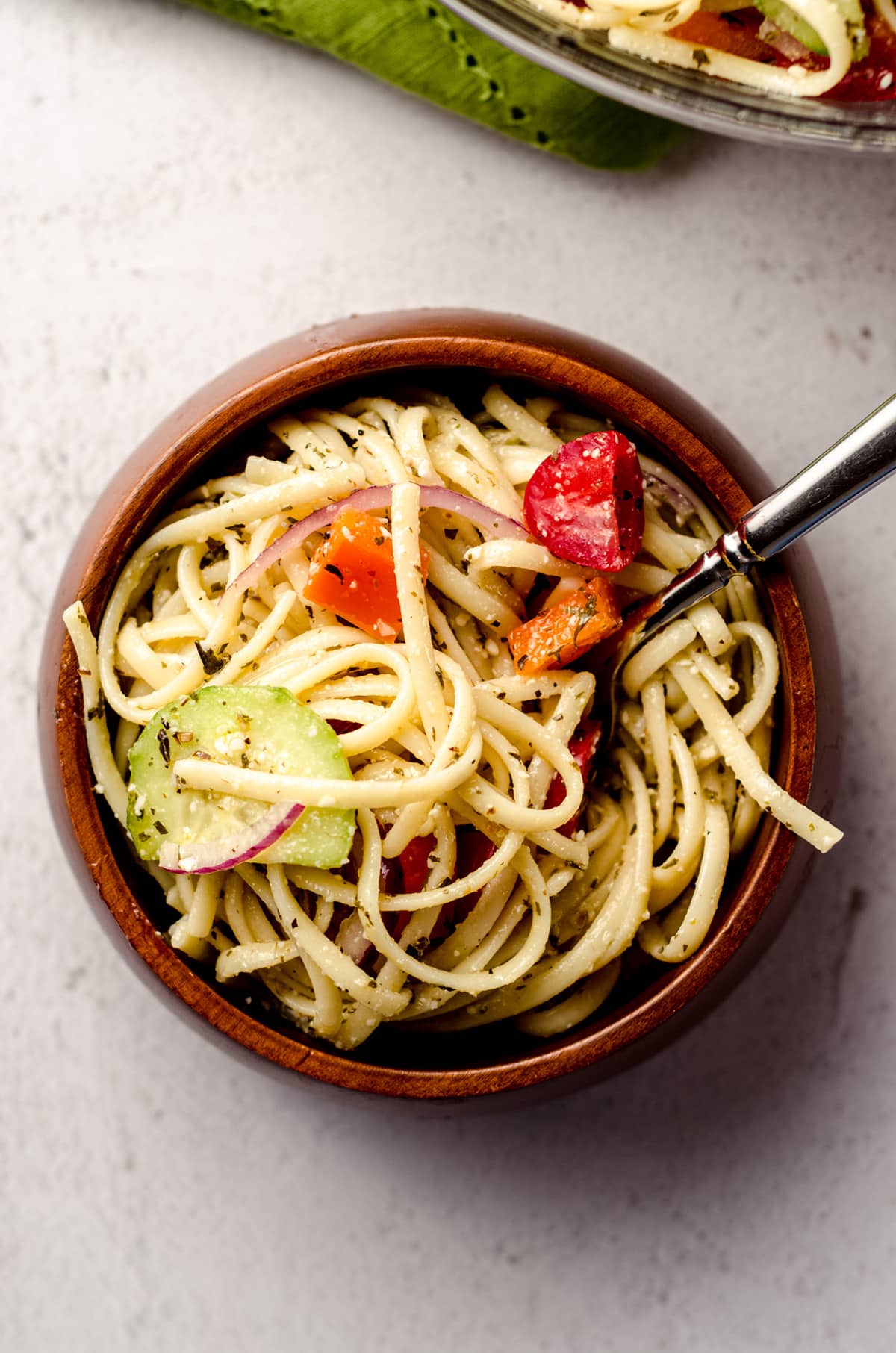 An overhead shot of a bowl of spaghetti pasta salad.