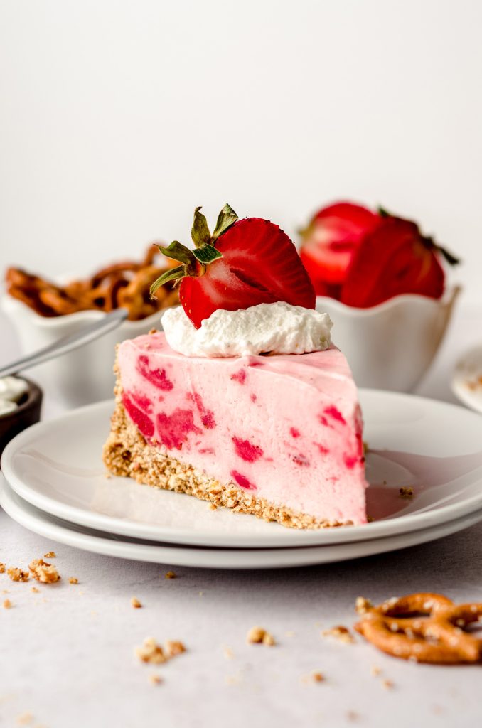 slice of strawberry pretzel pie on a plate