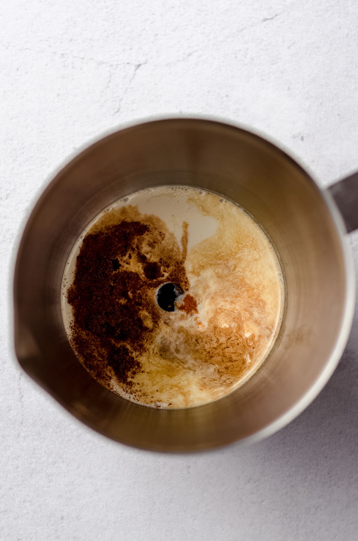 aerial photo of pumpkin cold foam ingredients in a frother