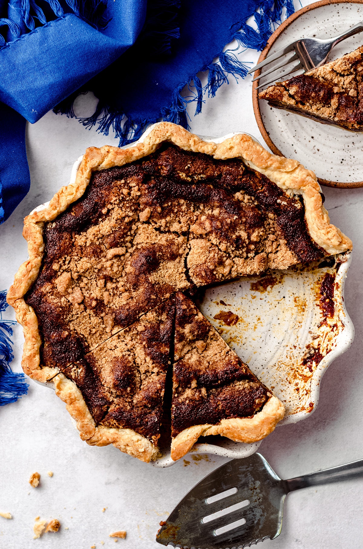 A shoofly pie with a piece missing.