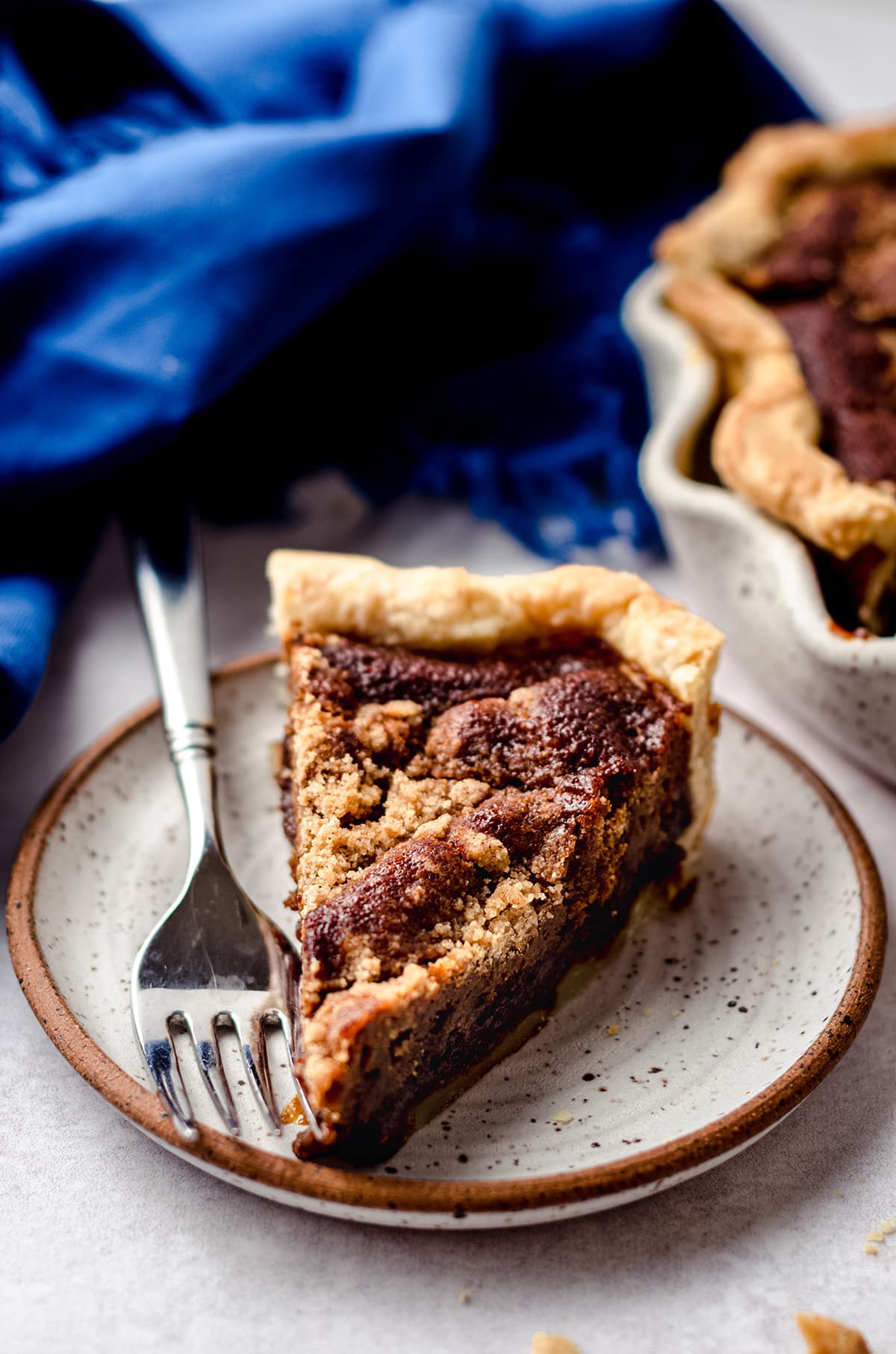 A slice of shoofly pie on a plate.