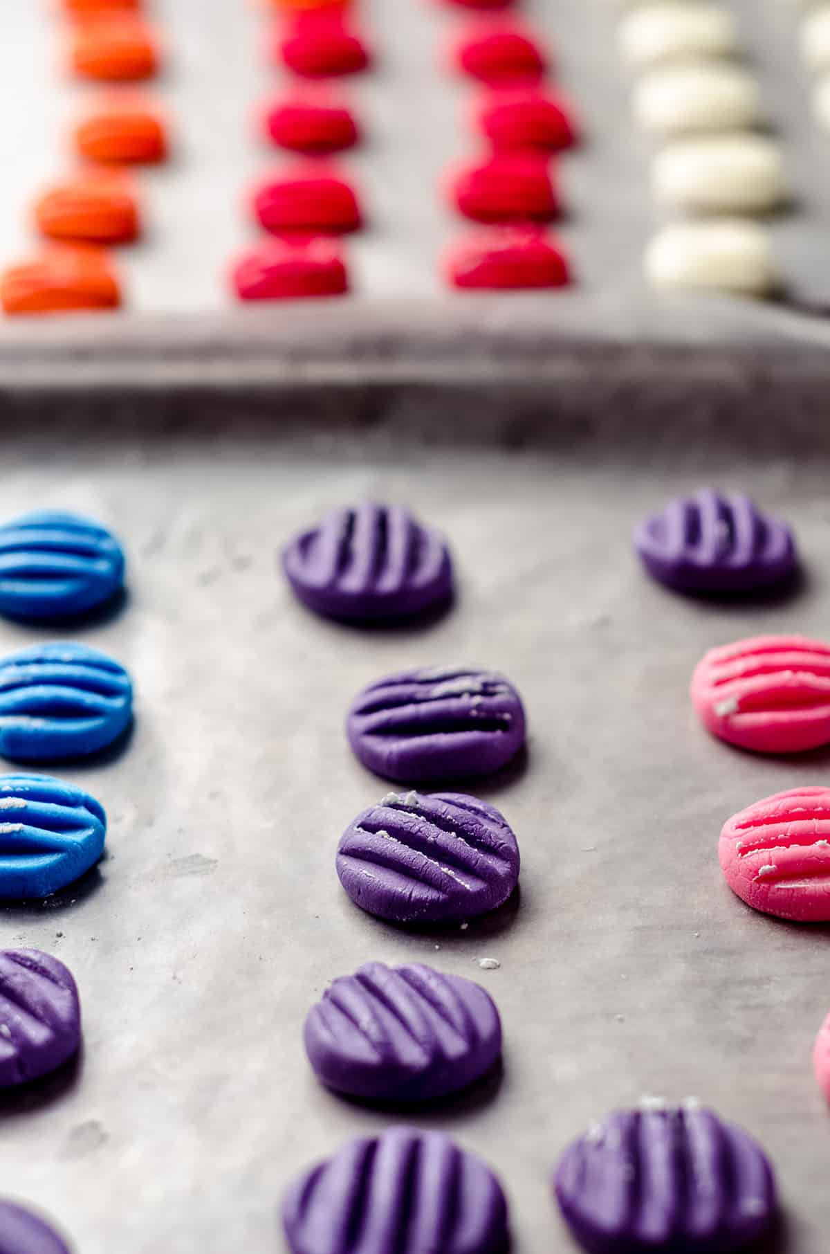 Baking sheets filled with colorful mint candies.