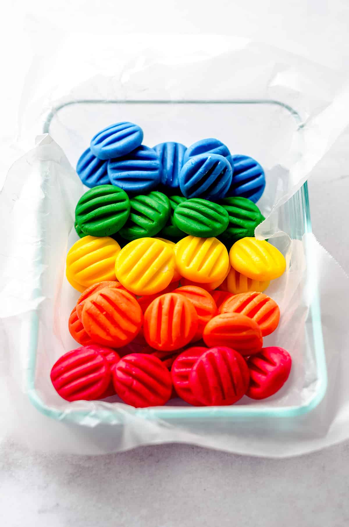 A container of rainbow homemade mints.