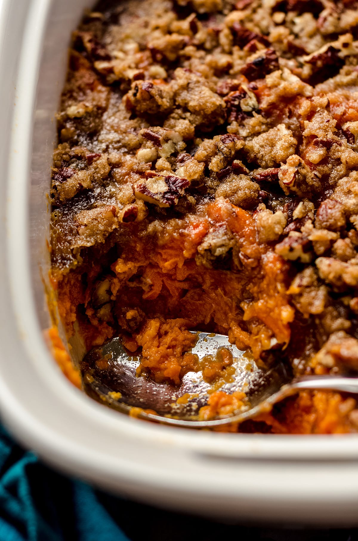 A sweet potato casserole topped with pecans.