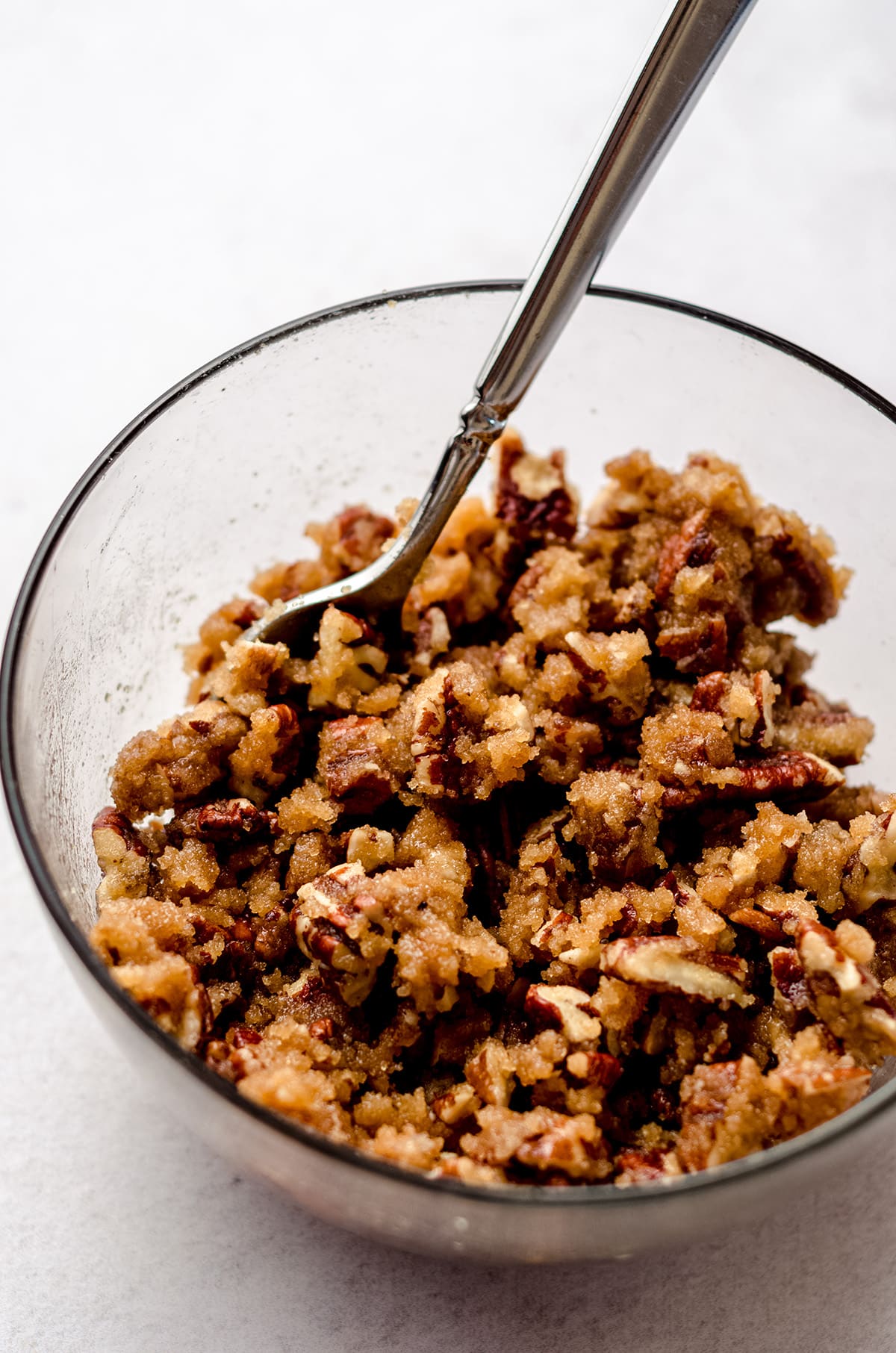 A bowl of a pecan streusel mixture.