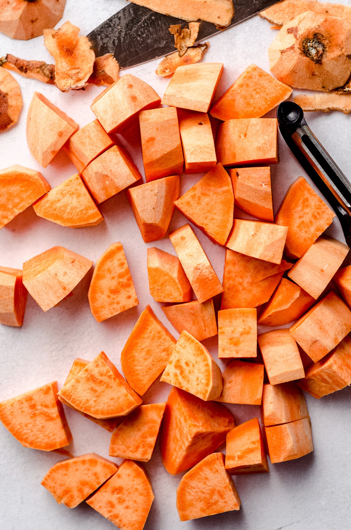 Sweet potato chunks on a white background.