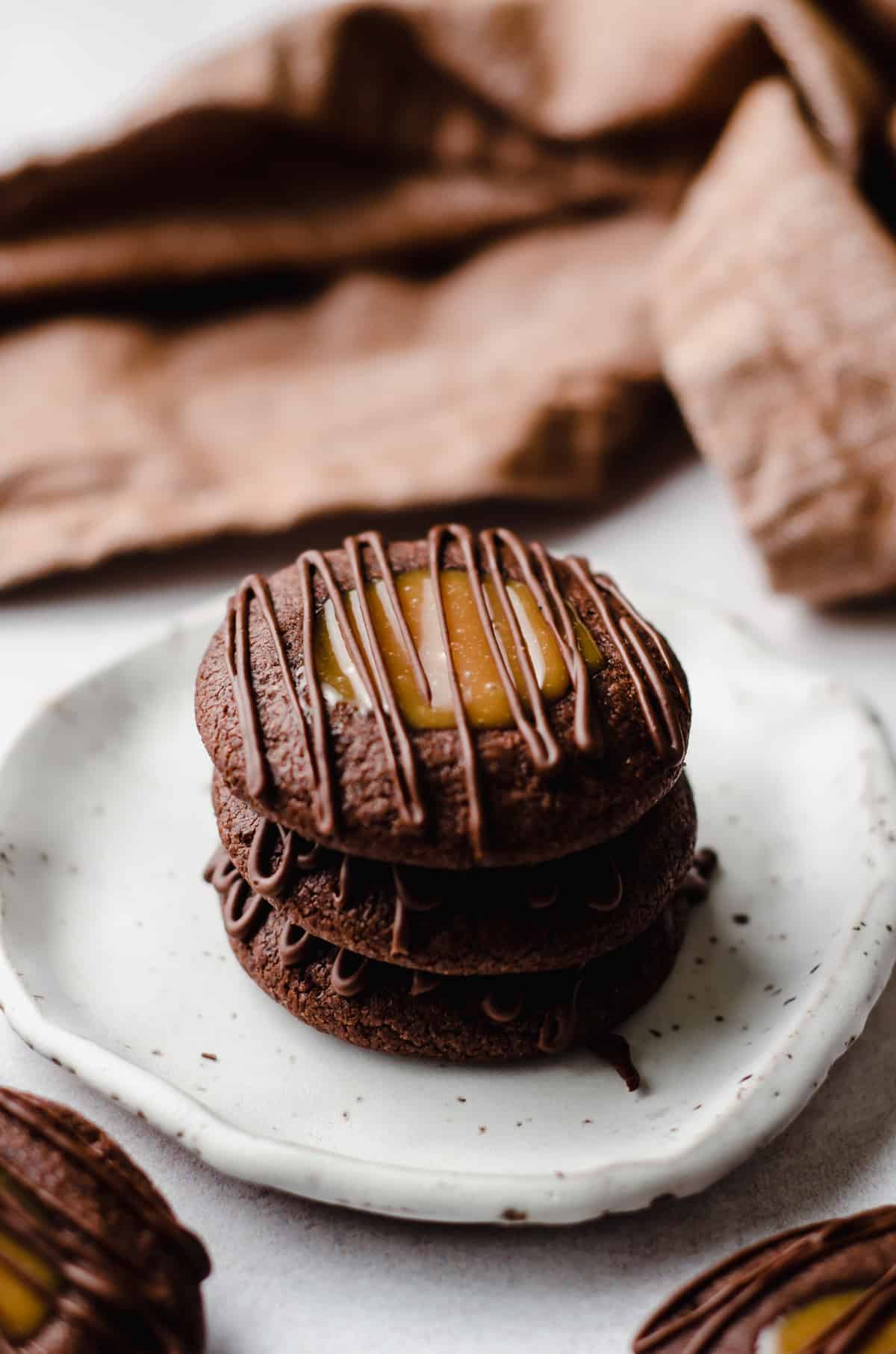 stack of salted caramel chocolate thumbprint cookies