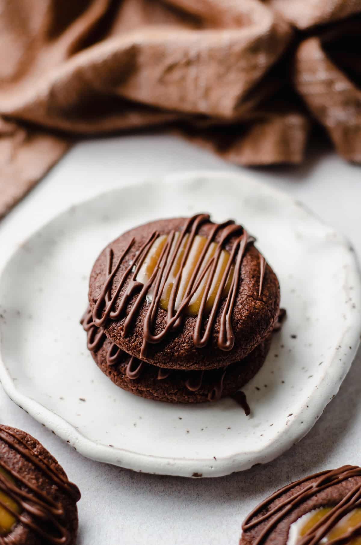 stack of salted caramel chocolate thumbprint cookies