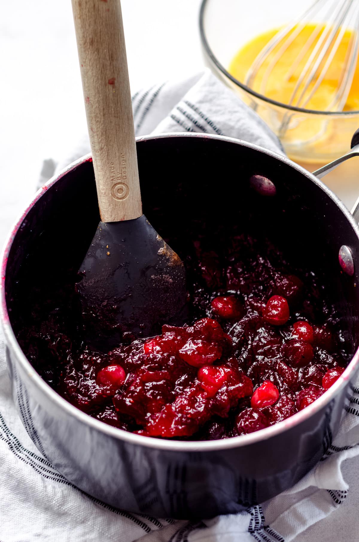 macerated cranberries in a saucepan ready to make cranberry curd