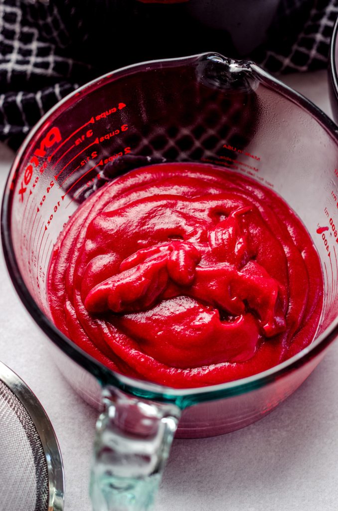 cranberry curd in a large glass measuring cup