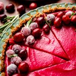 sliced cranberry curt tart on a plate