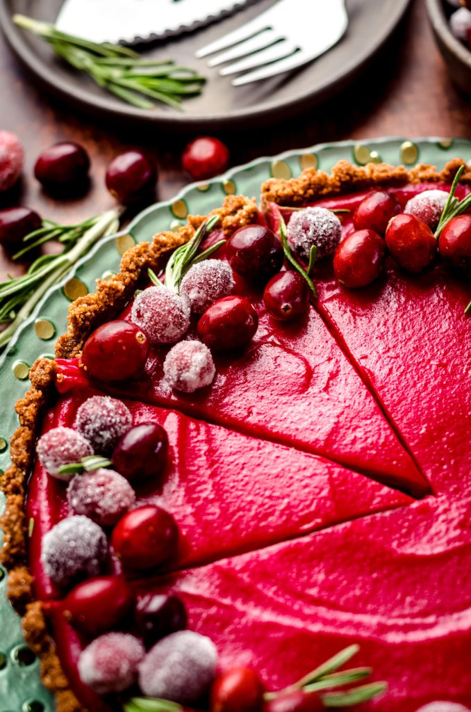 sliced cranberry curt tart on a plate