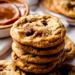 A stack of dulce de leche cookies with chocolate chips.