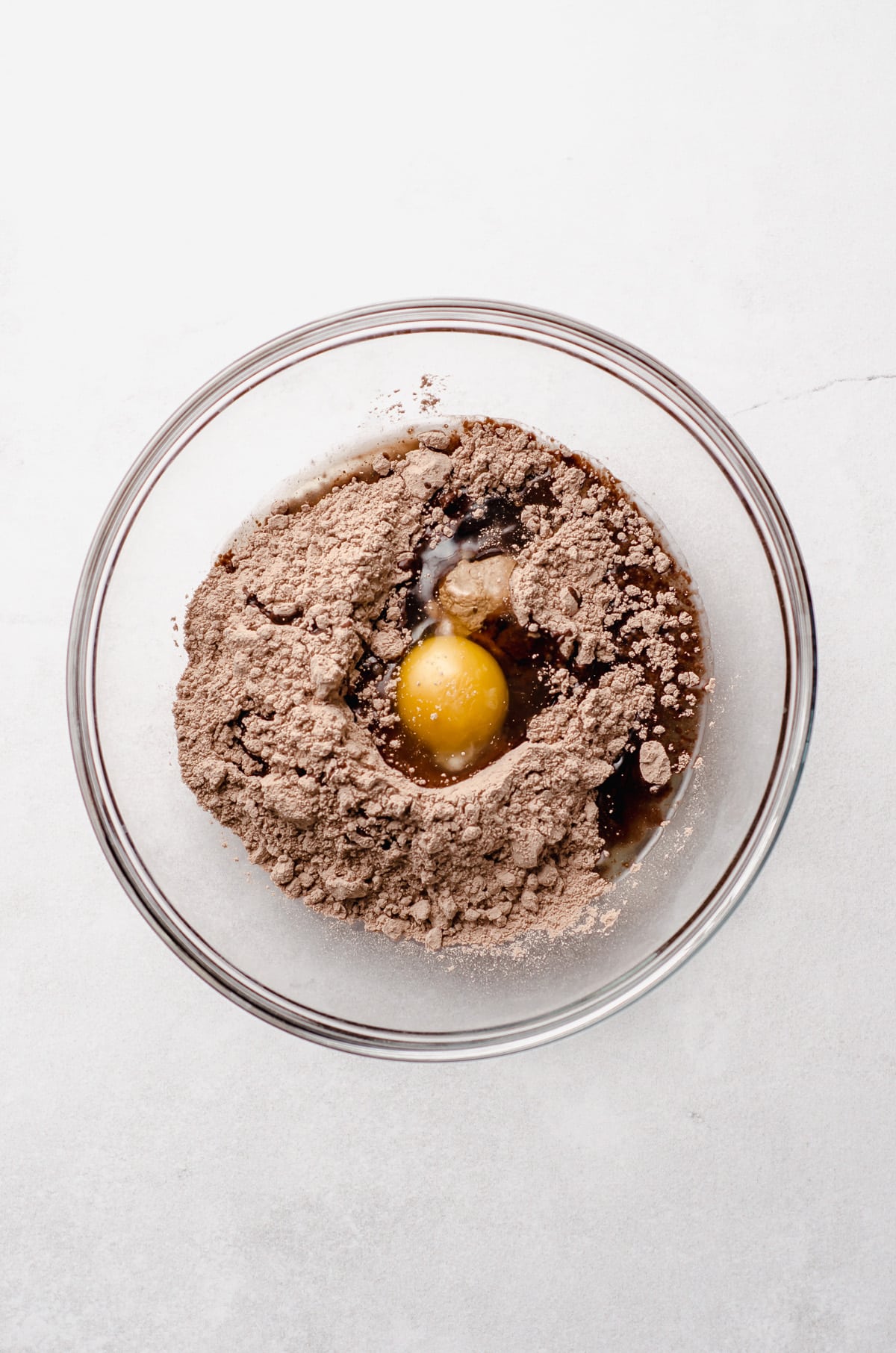 devil's food cake mix in a bowl with oil and an egg to make hot cocoa cookies