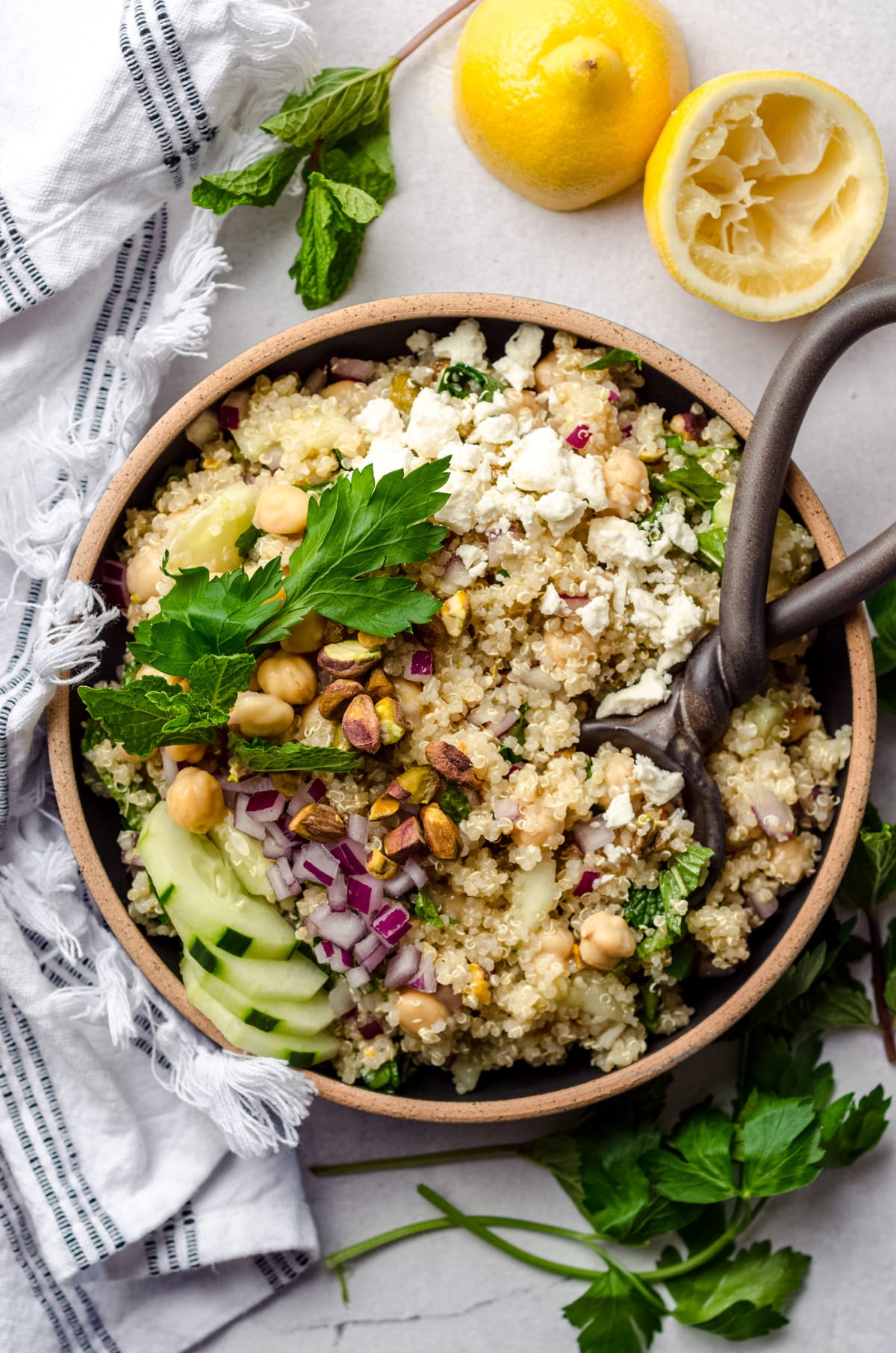 aerial photo of Jennifer Aniston salad in a bowl with a serving spoon