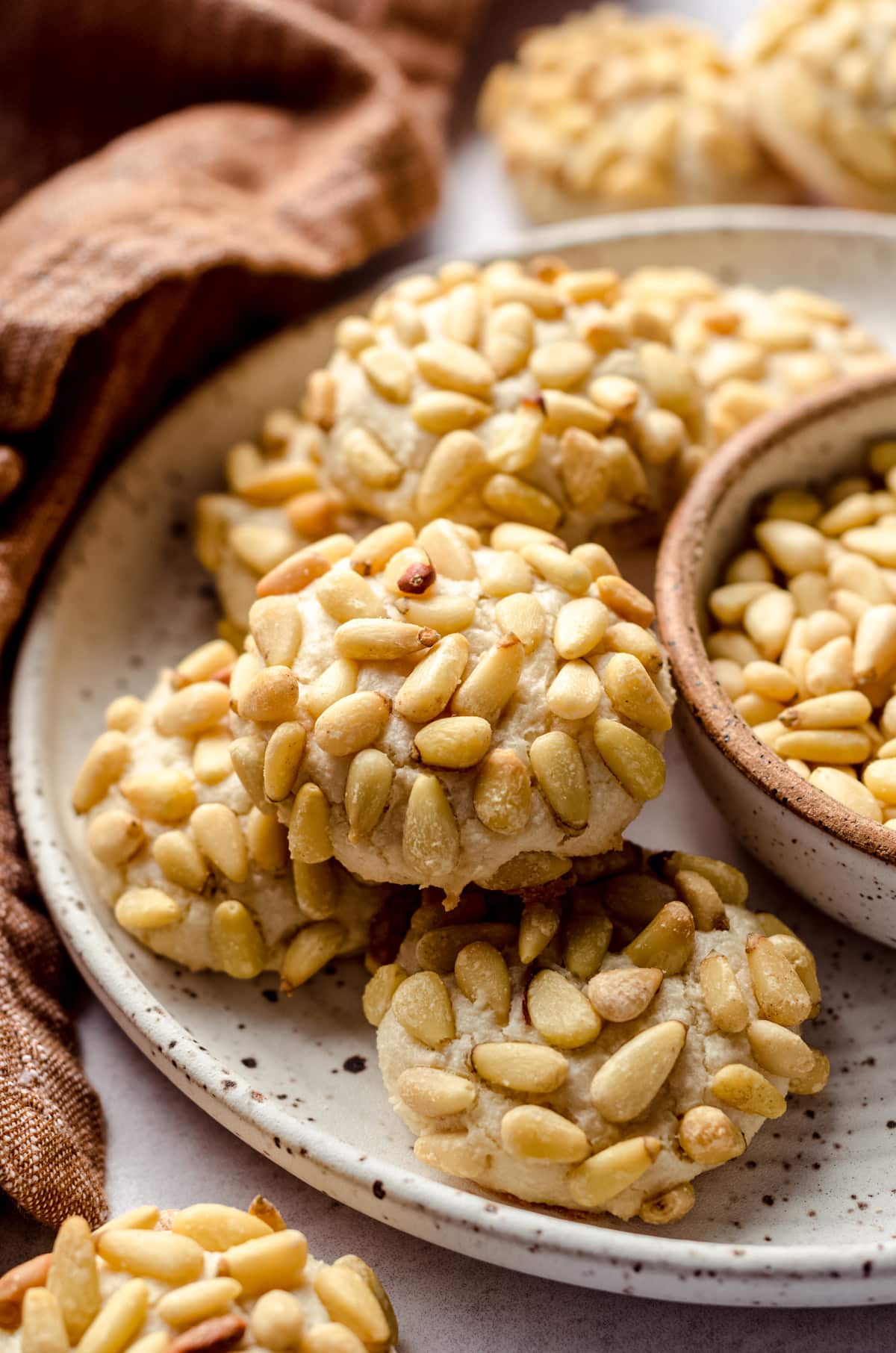 A plate of pine nut encrusted cookies.