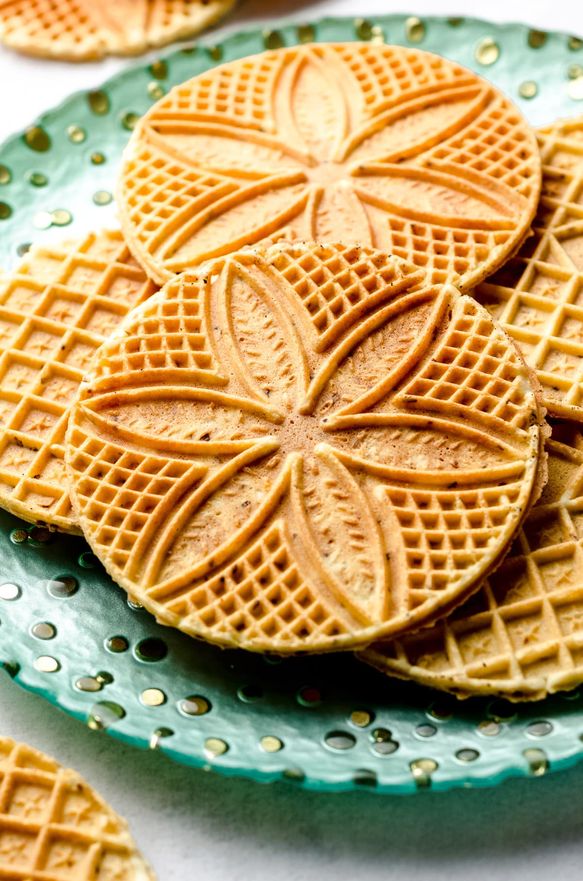 Pressed Italian waffle cookies on a platter.
