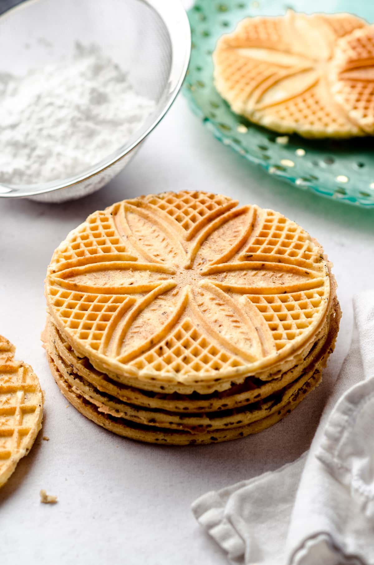 A stack of cooked pizzelles.
