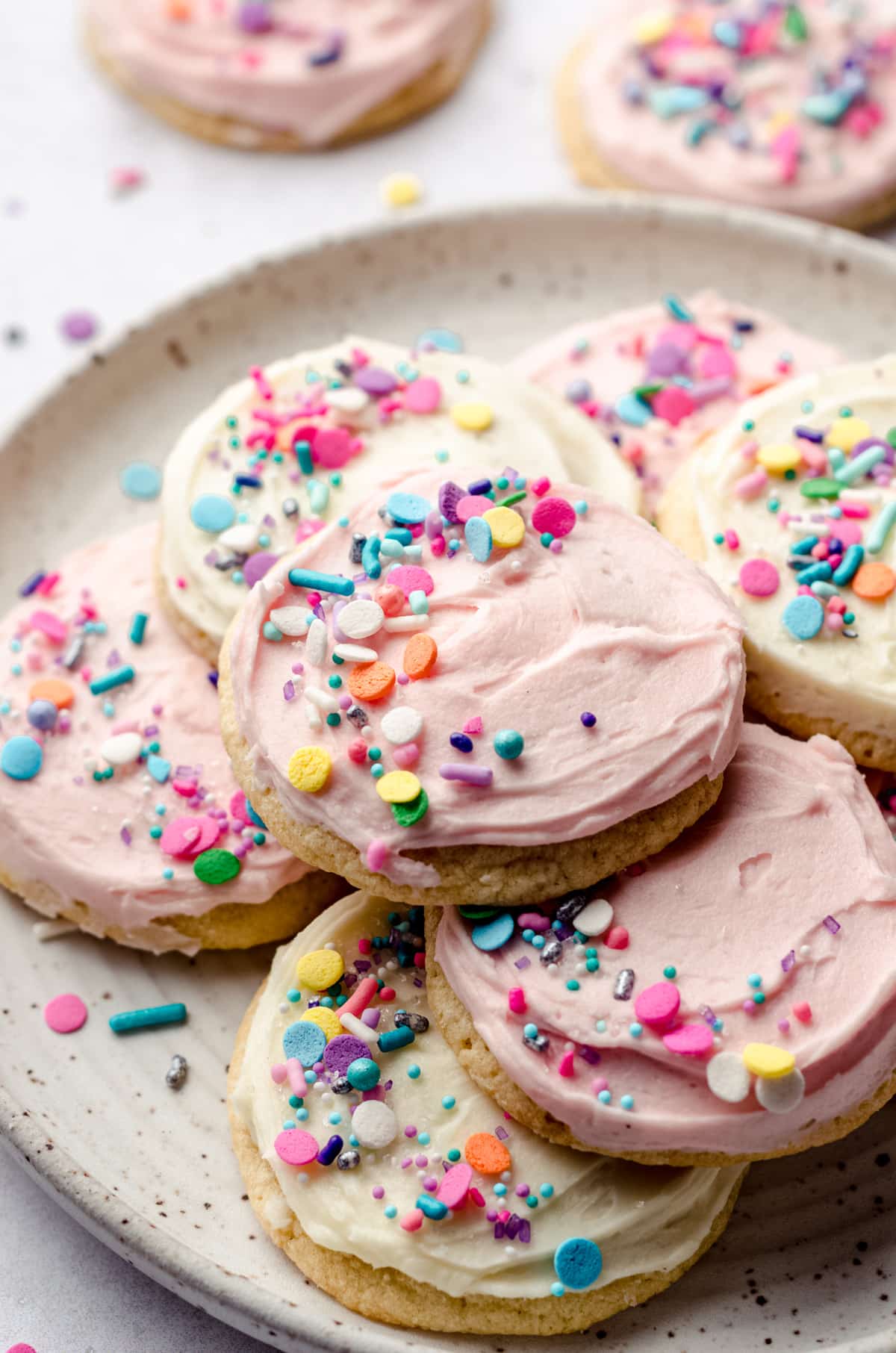 frosted sugar cookies on a plate