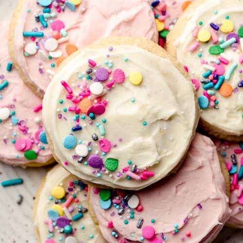 aerial photo of frosted sugar cookies on a plate