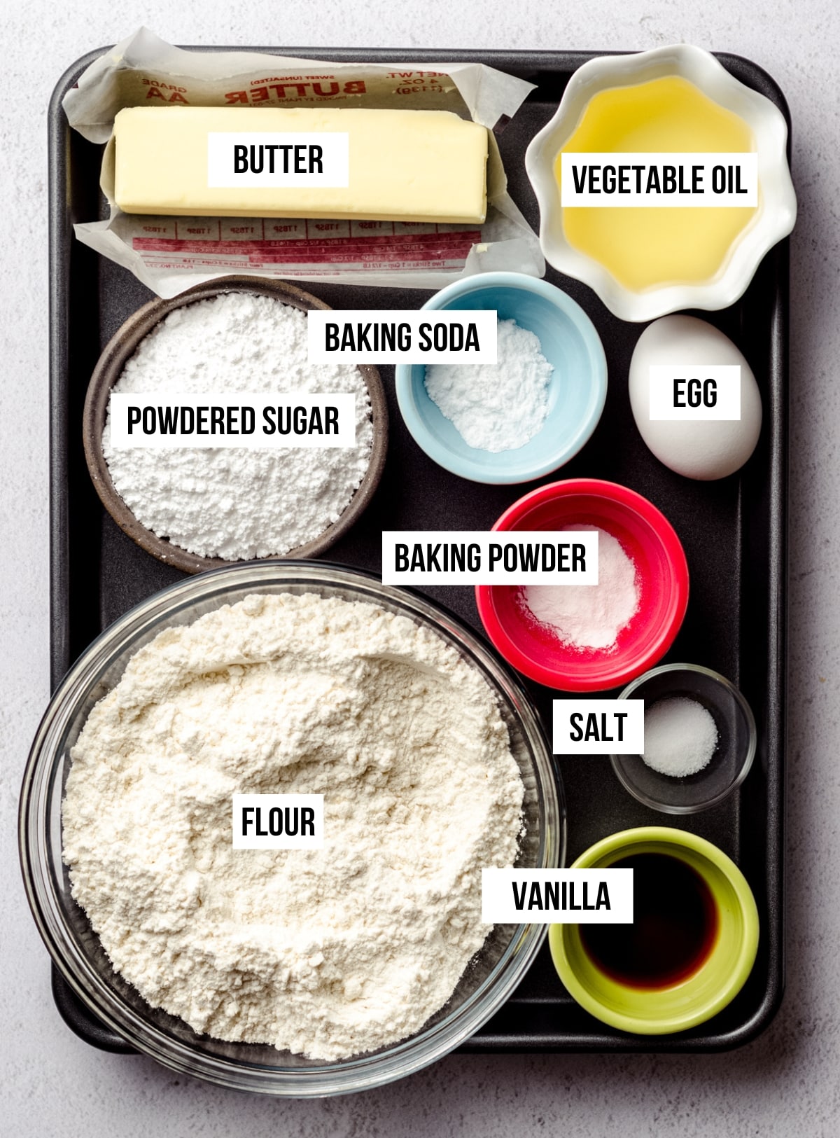 Aerial photo of labeled ingredients for vanilla bean sugar cookies.