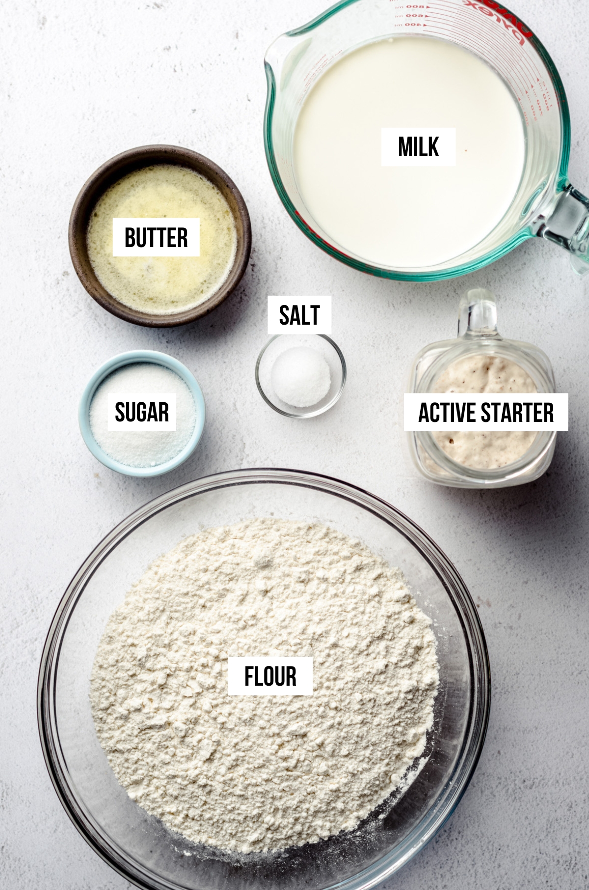 Ingredients for sourdough rolls labeled with text overlay.