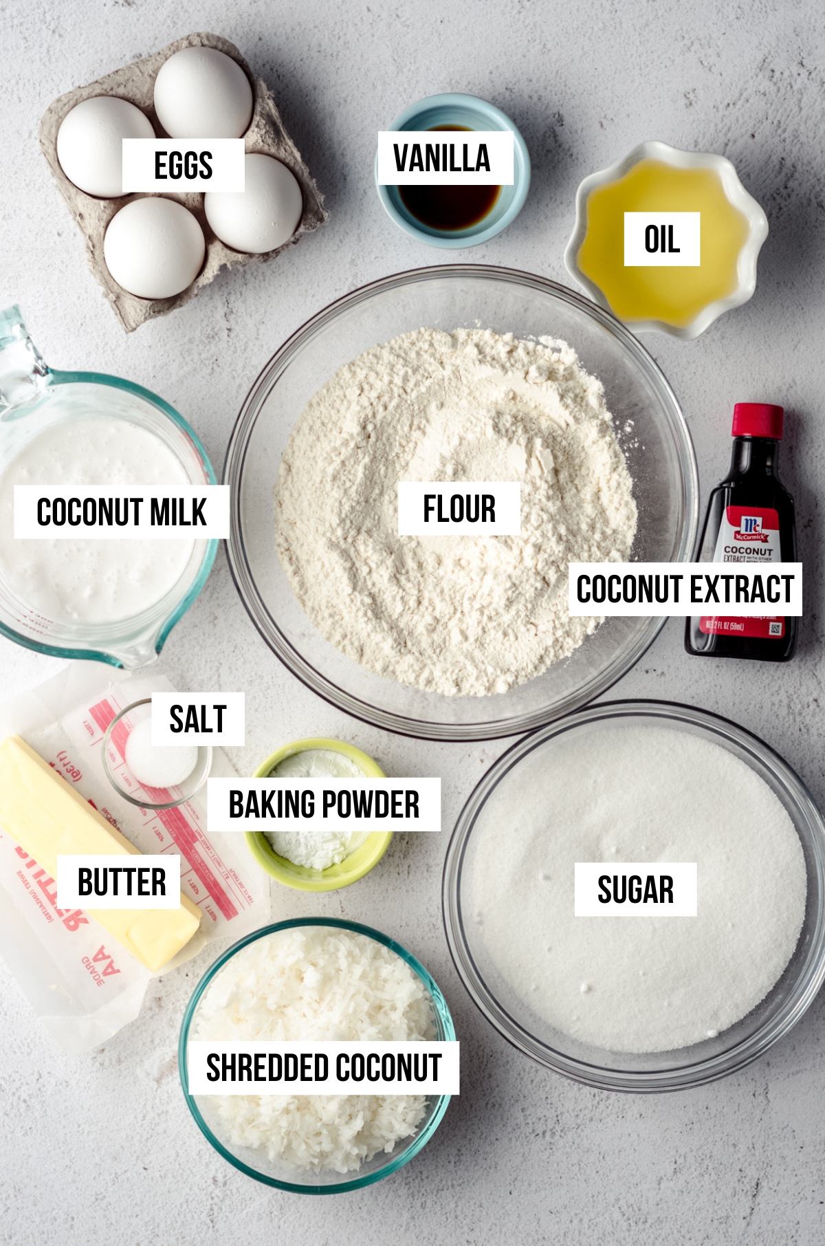 ingredients needed for coconut bundt cake laid out on a counter.