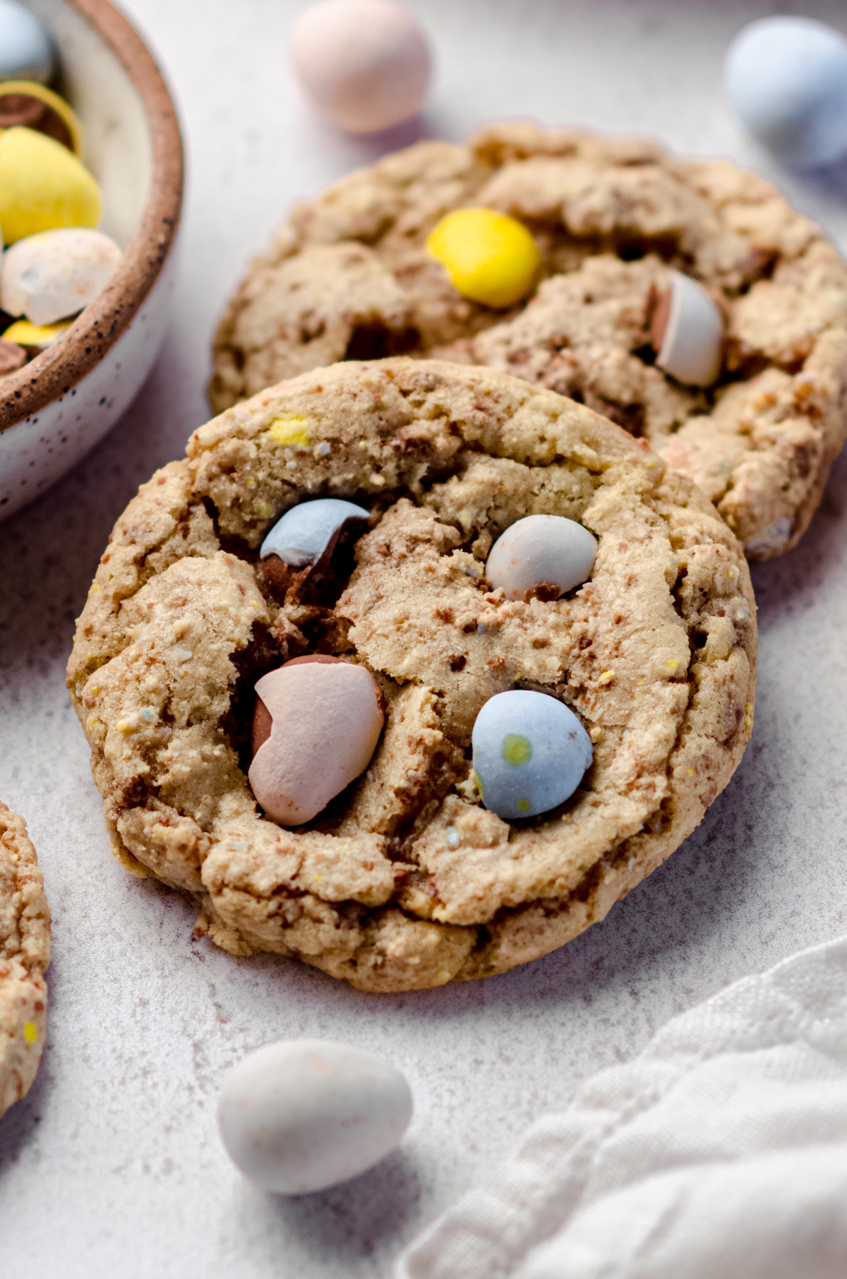 Mini egg cookies on a surface.