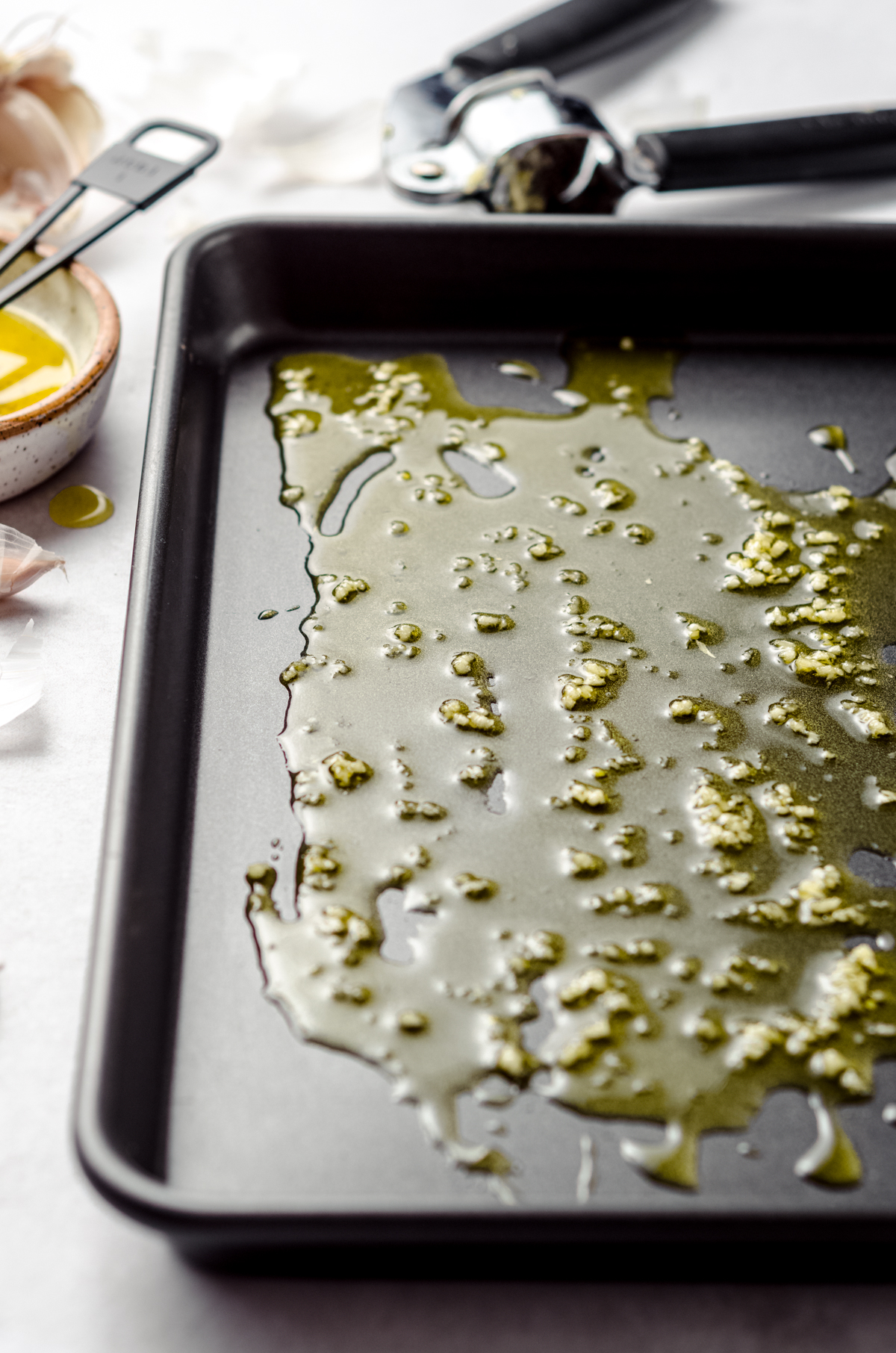 An oiled baking dish for focaccia bread.