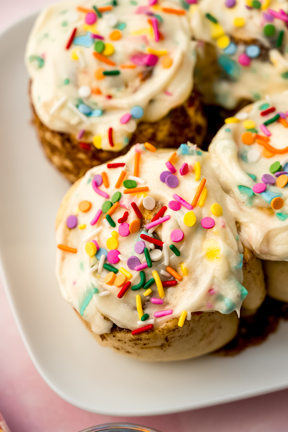 Funfetti cinnamon rolls on a plate.
