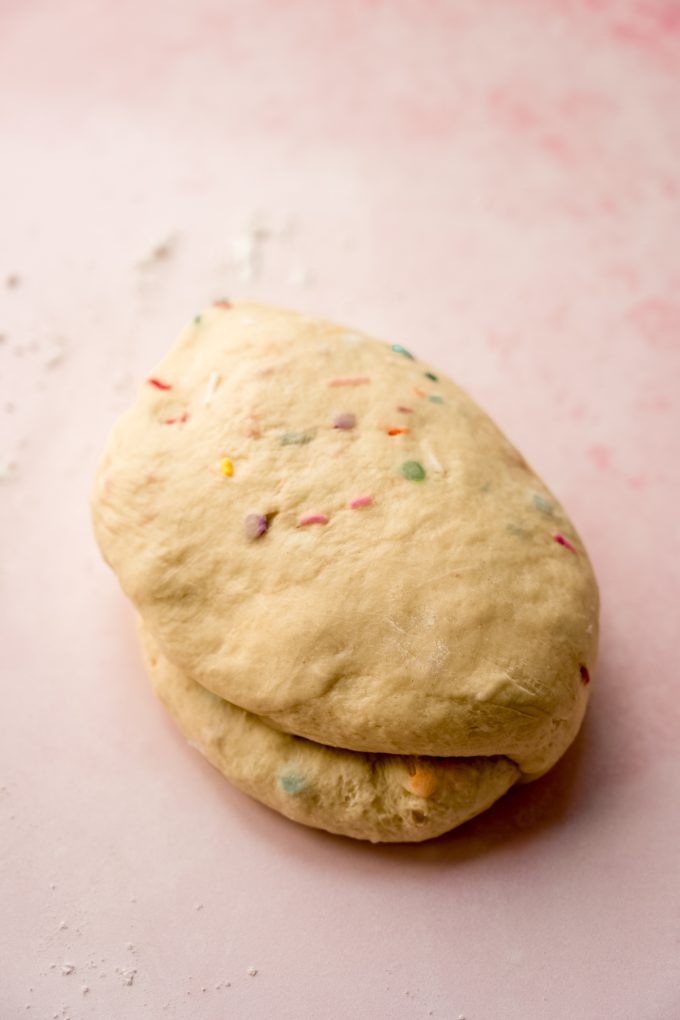 Funfetti cinnamon roll dough on a surface.