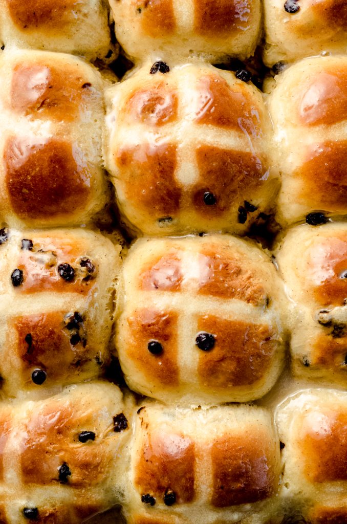 Aerial photo of hot cross buns in a pan.