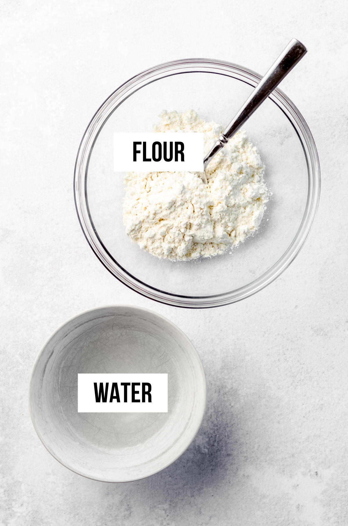 Overhead photo of ingredients for flour paste for hot cross buns labeled with text overlay.