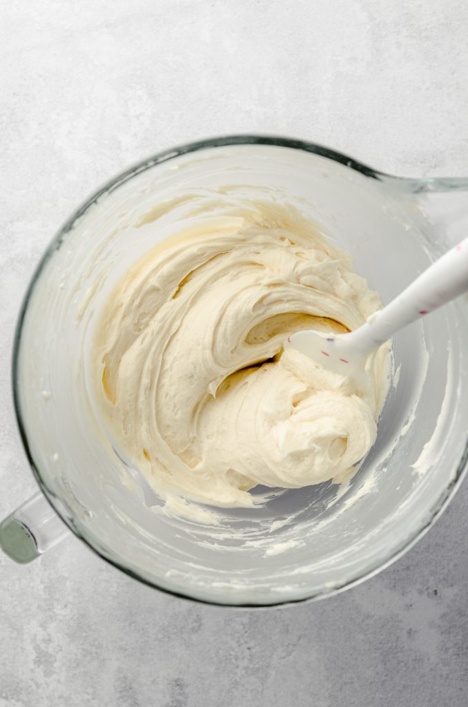 Aerial photo of vanilla buttercream in a bowl after stirring all the air bubbles out.
