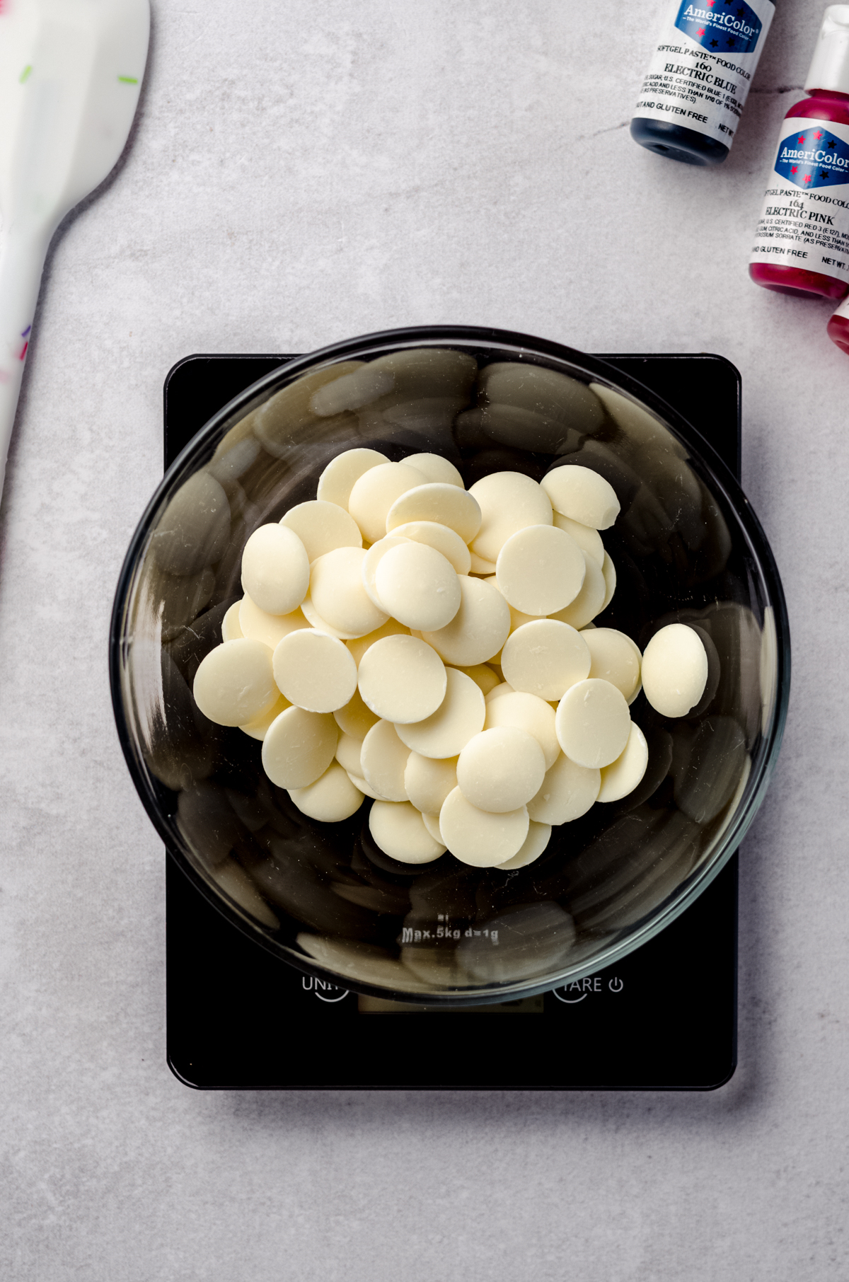 Aerial photo of a bowl of white chocolate melting wafers.