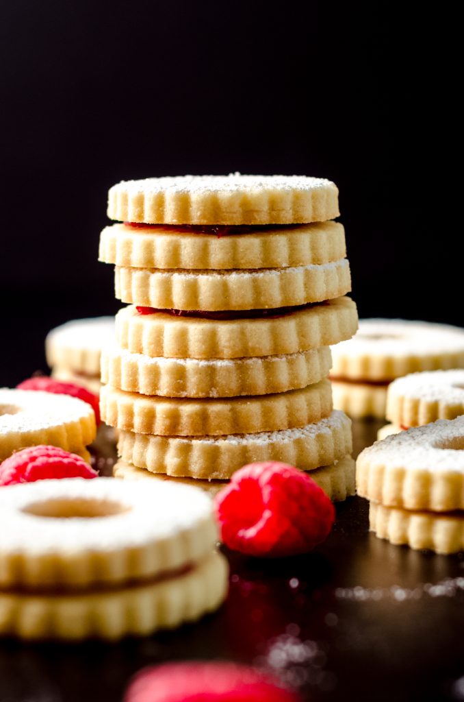 A stack of raspberry Linzer cookies.