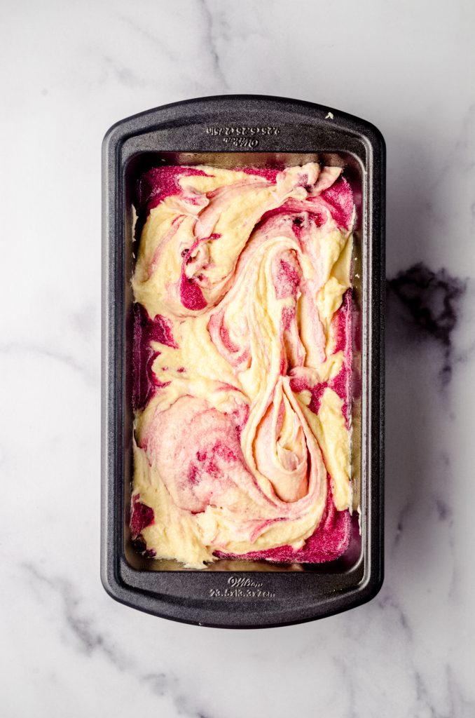 Aerial photo of blackberry pound cake batter in a loaf pan.