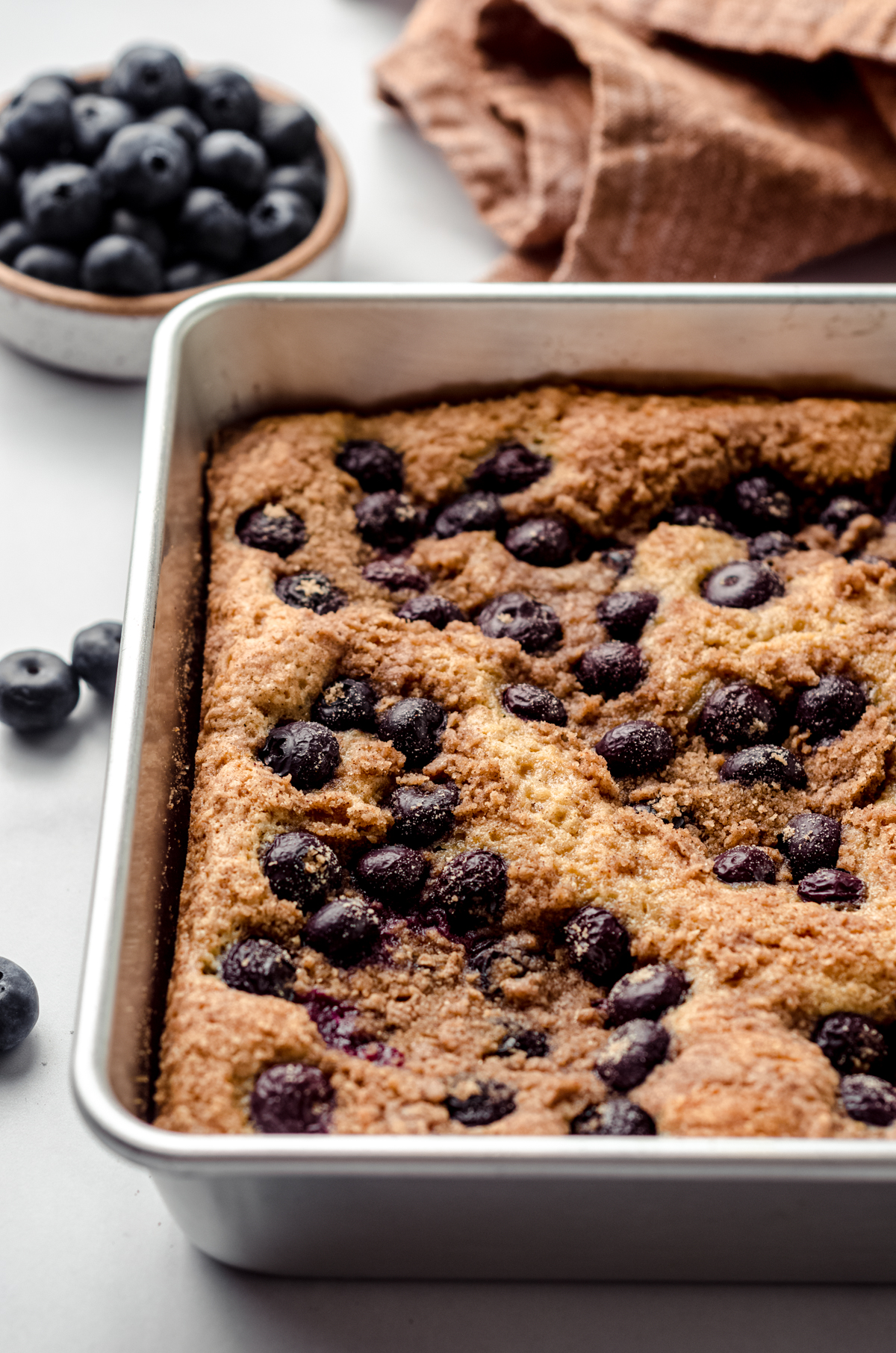 Blueberry sour cream coffee cake in a baking pan.