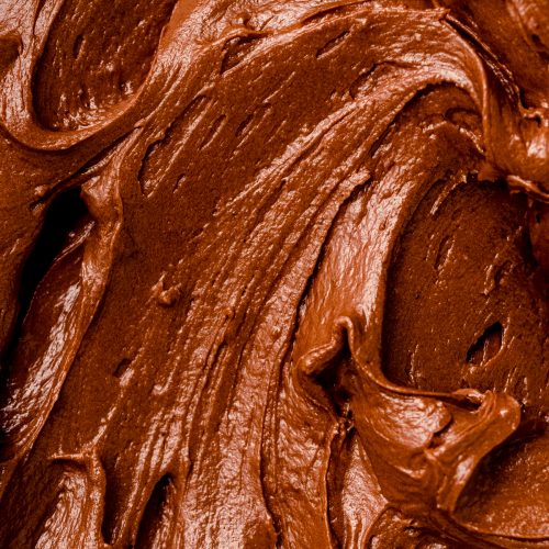 A closeup of chocolate fudge frosting.