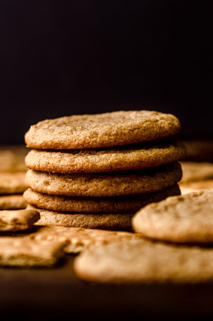 Graham cracker cookies on a surface with graham crackers around it.