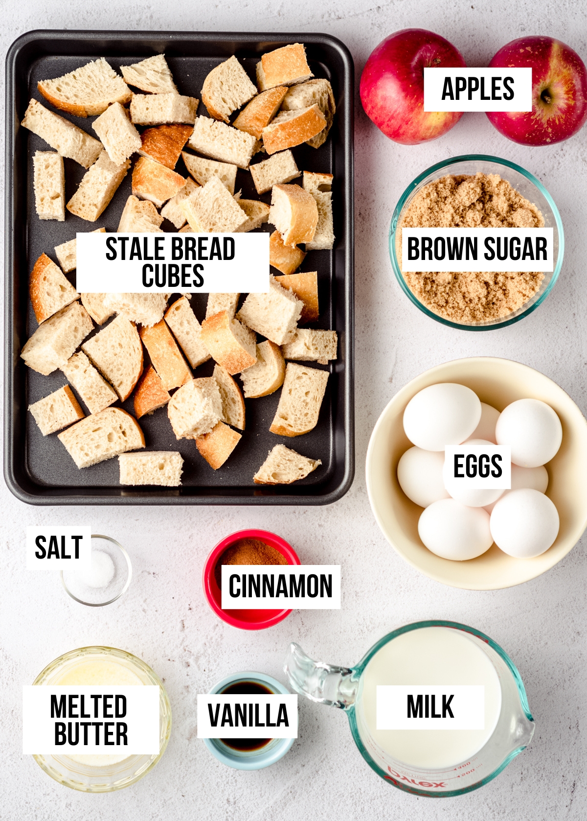 Aerial photo of ingredients for apple French toast casserole with text overlay.