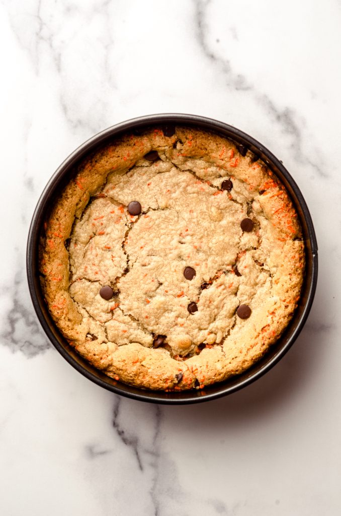 A baked Halloween cookie cake dough baked in a springform pan.