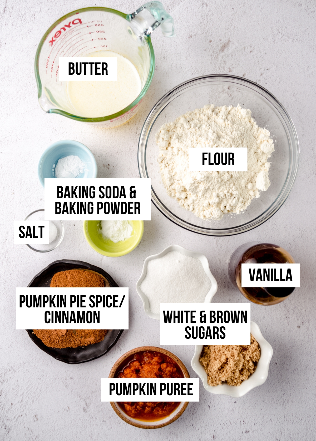 Ingredients for frosted pumpkin cookies with text overlay.